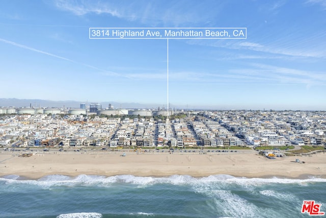 aerial view featuring a water view and a beach view