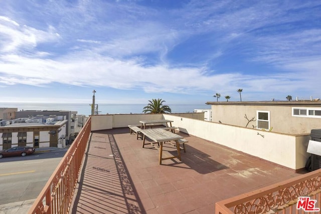 view of patio featuring a water view