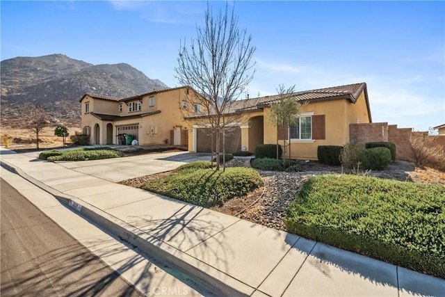 mediterranean / spanish-style house featuring a mountain view