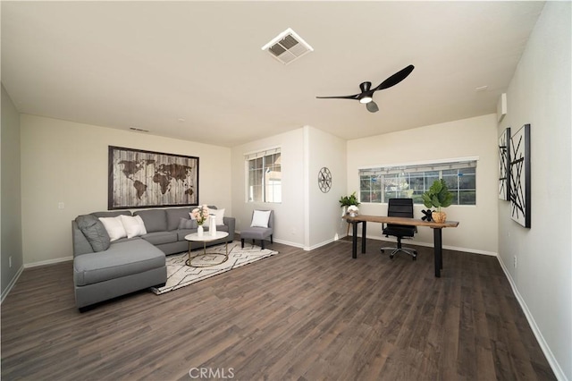 home office featuring baseboards, visible vents, ceiling fan, and dark wood-style flooring