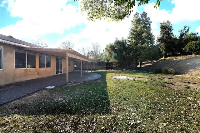 view of yard featuring a patio area and fence