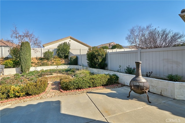 view of patio / terrace featuring an outdoor fire pit