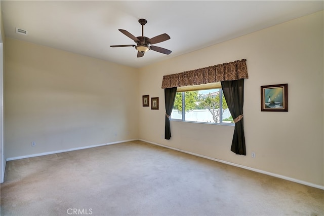 unfurnished room featuring carpet and ceiling fan