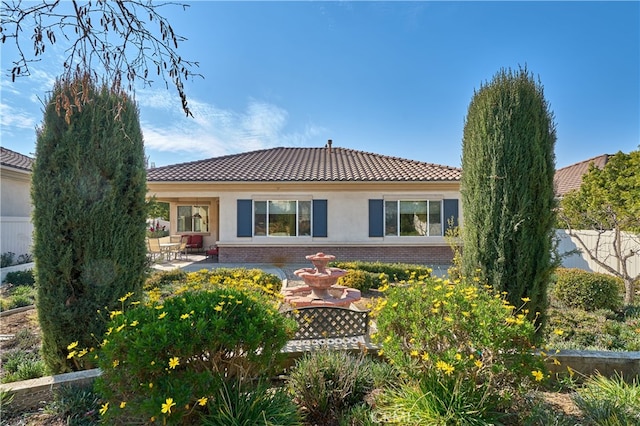 rear view of property with a patio area