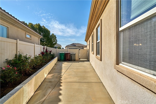 view of side of home with a patio