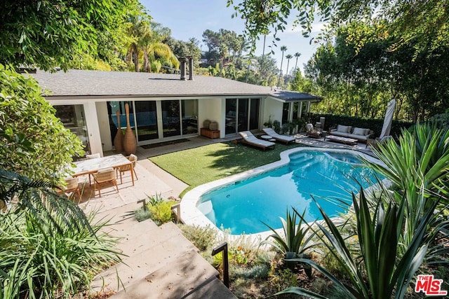 view of pool with an outdoor hangout area and a patio area