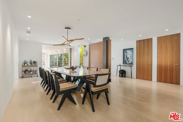 dining space with light hardwood / wood-style flooring