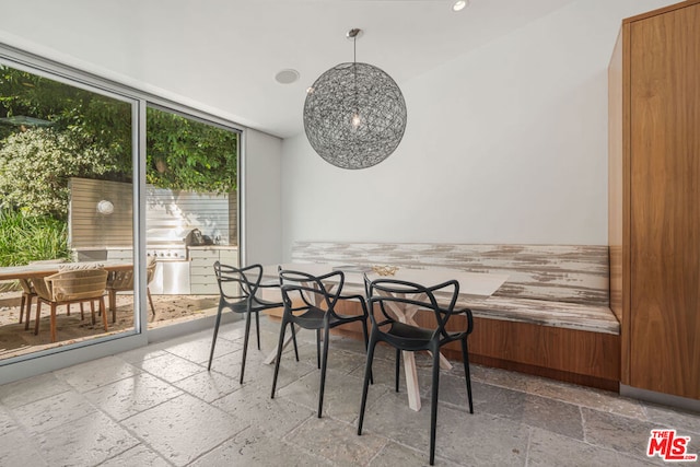 dining area with floor to ceiling windows