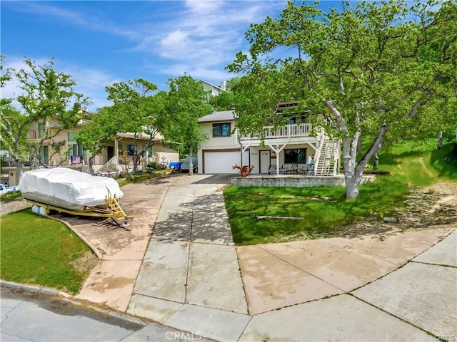 view of front facade with a front lawn and a garage