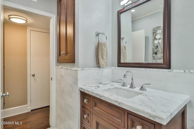 bathroom with vanity and wood-type flooring