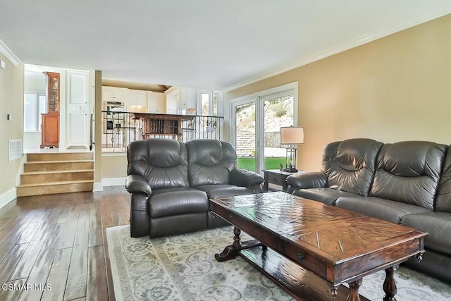 living room featuring ornamental molding and hardwood / wood-style flooring