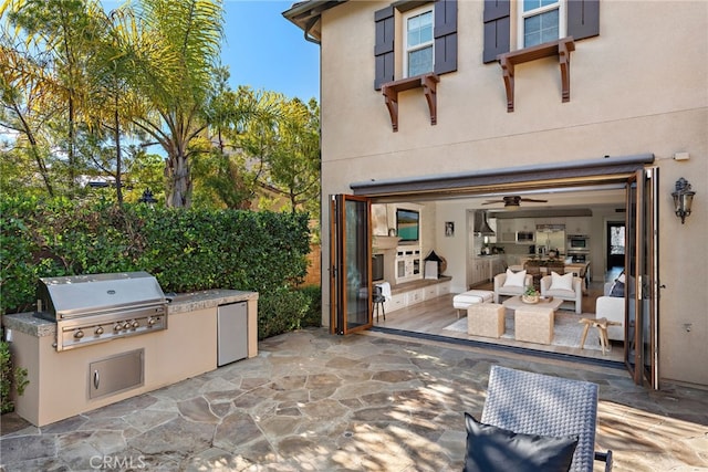 view of patio with a grill and an outdoor kitchen