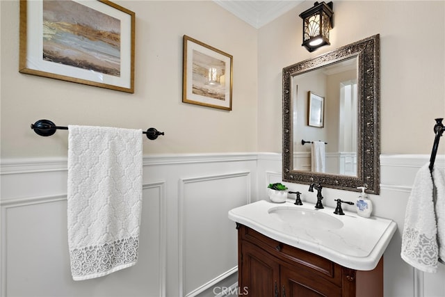 bathroom featuring vanity and ornamental molding