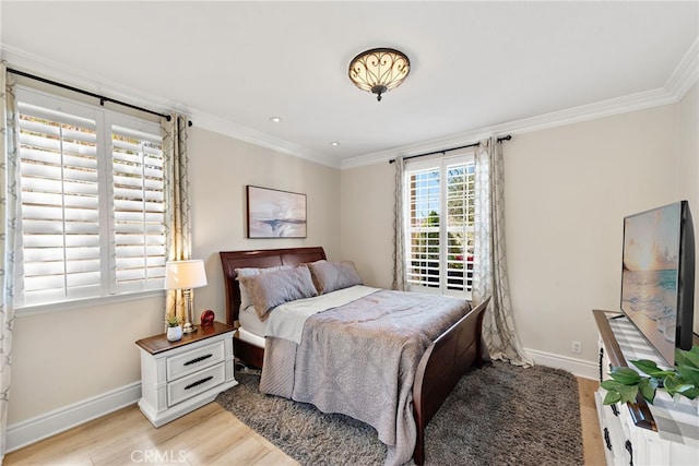 bedroom featuring light hardwood / wood-style flooring and ornamental molding