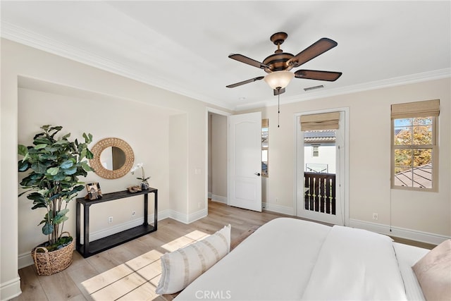 bedroom with ceiling fan, ornamental molding, and light wood-type flooring