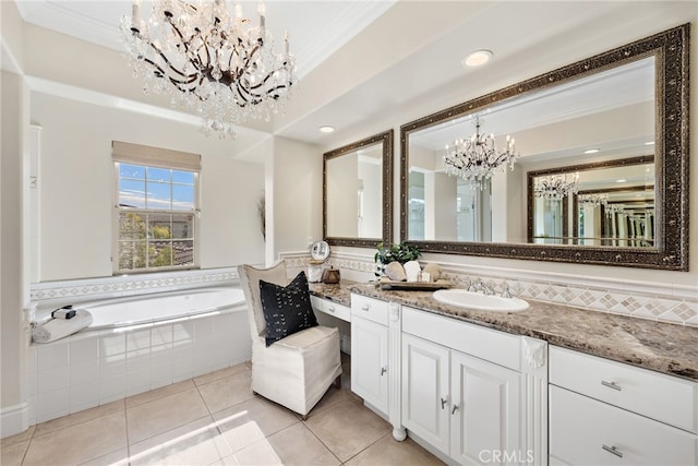 bathroom featuring tiled bath, an inviting chandelier, tile patterned floors, crown molding, and vanity