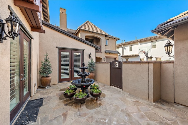 view of patio featuring french doors