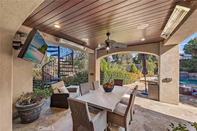 view of patio / terrace featuring ceiling fan