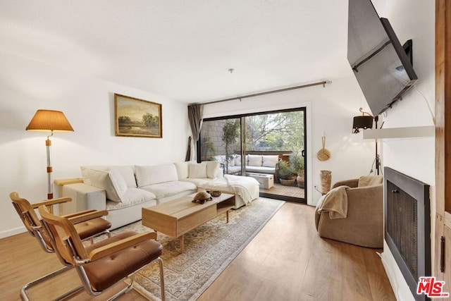 living room with light hardwood / wood-style floors