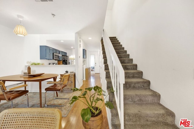 stairway with wood-type flooring