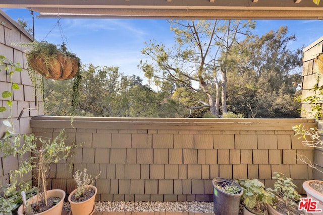 view of yard with a balcony