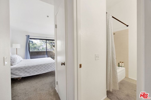 bedroom featuring light carpet