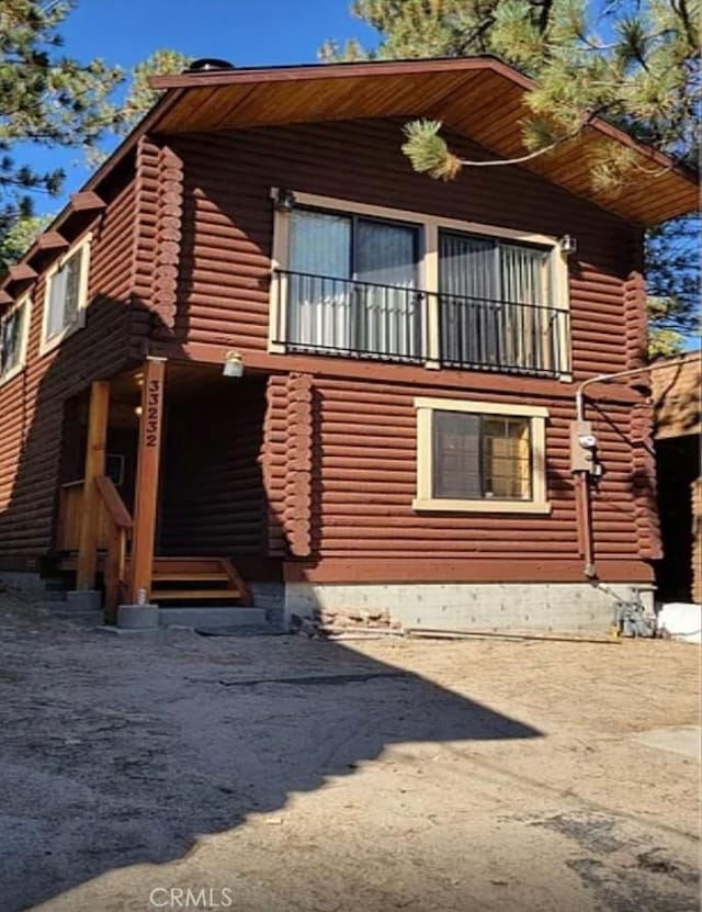 view of property exterior featuring a balcony