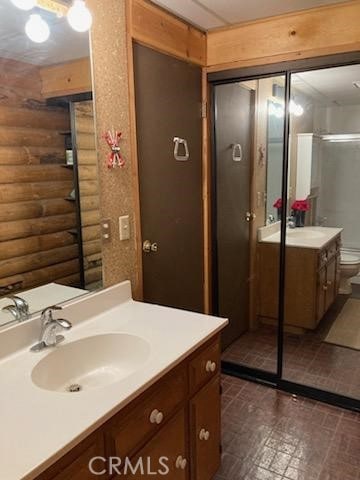 full bathroom featuring vanity and toilet