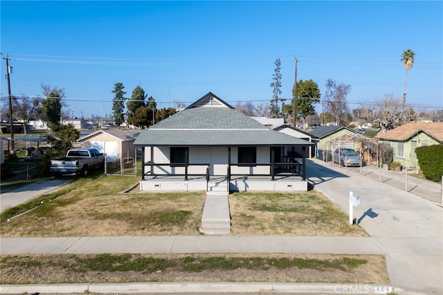 view of front of home with covered porch and a front yard