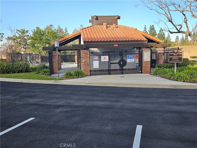 exterior space with fence and a gate