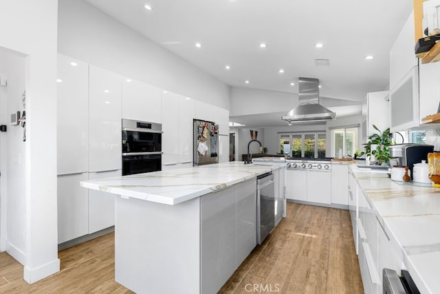 kitchen featuring stainless steel appliances, white cabinets, a kitchen island, island range hood, and modern cabinets