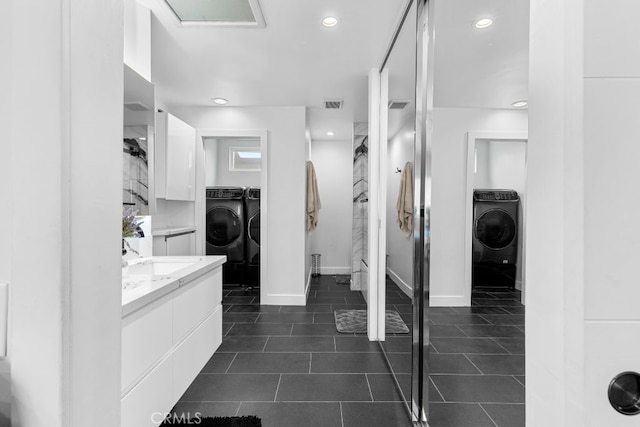 full bath featuring tile patterned floors, recessed lighting, visible vents, and vanity