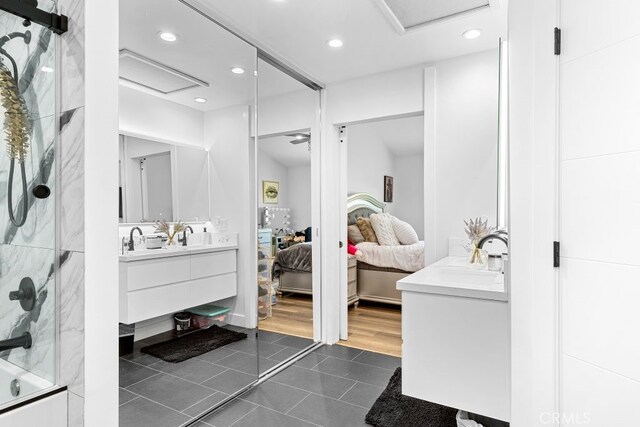 full bath with tile patterned flooring, ensuite bath, vanity, and recessed lighting