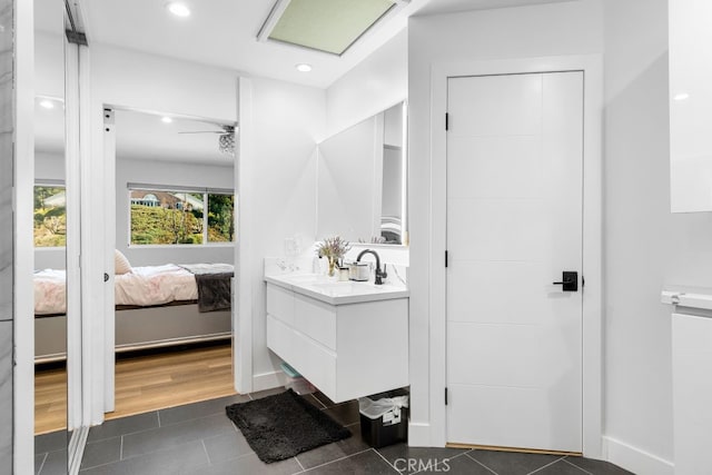 ensuite bathroom with tile patterned flooring, ensuite bath, vanity, and recessed lighting