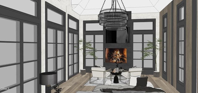 sunroom featuring a chandelier and a fireplace