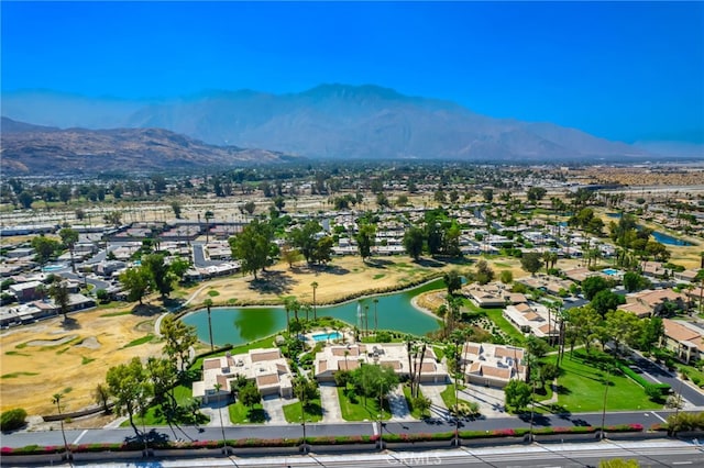 aerial view featuring a water and mountain view