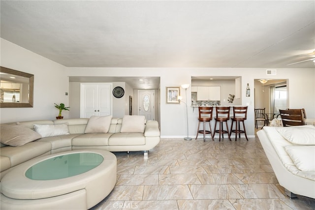 living room with ceiling fan