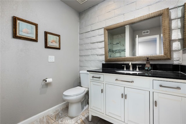 bathroom featuring toilet and vanity