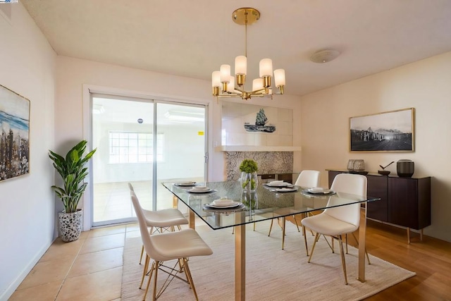 tiled dining area with a notable chandelier