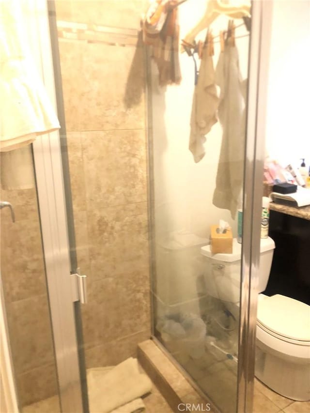 bathroom with toilet and walk in shower