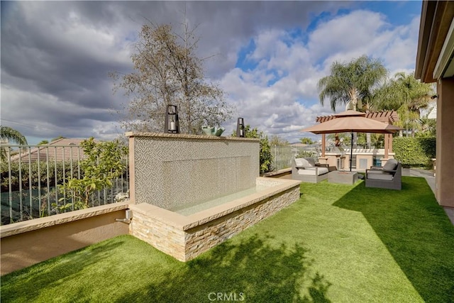 view of yard with a gazebo and an outdoor hangout area