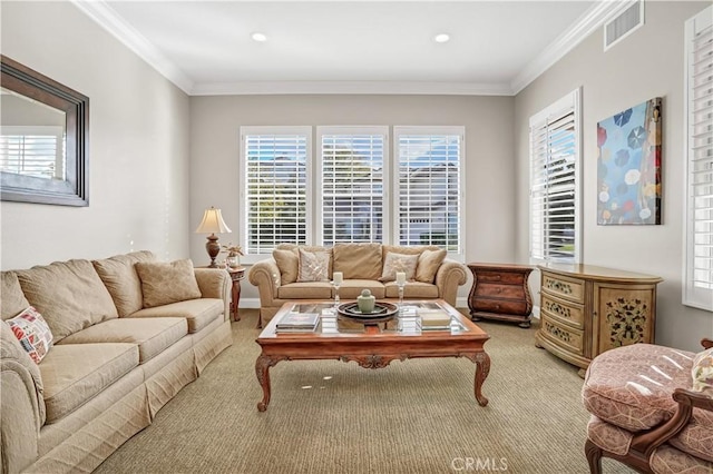 carpeted living room with plenty of natural light and ornamental molding