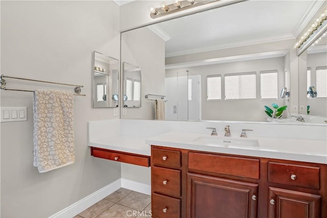 bathroom featuring crown molding, vanity, and tile patterned flooring