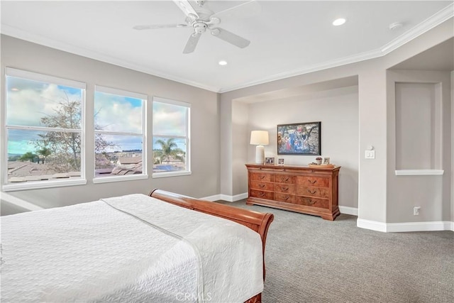 carpeted bedroom featuring ornamental molding and ceiling fan