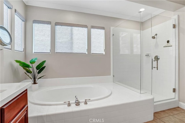 bathroom with vanity, tile patterned flooring, and separate shower and tub