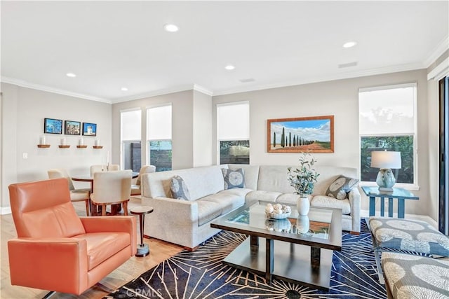 living room featuring ornamental molding and light hardwood / wood-style floors