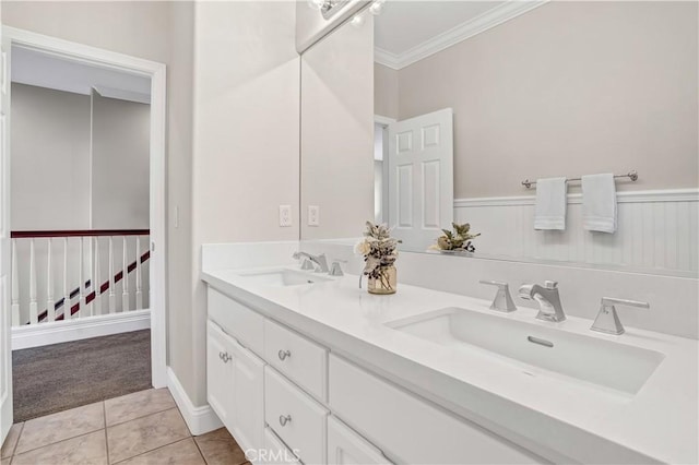 bathroom featuring crown molding, tile patterned floors, and vanity