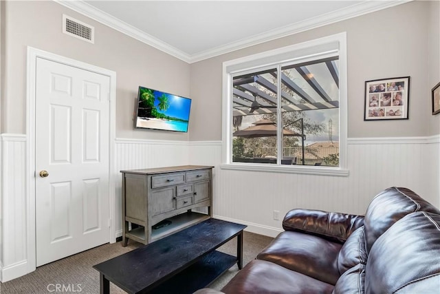 living room with crown molding and carpet floors