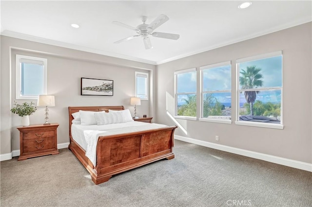 bedroom featuring crown molding, light carpet, and ceiling fan