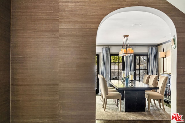 dining area with crown molding